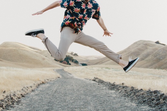 Man jumping for joy because of bonus $25 on GMAT